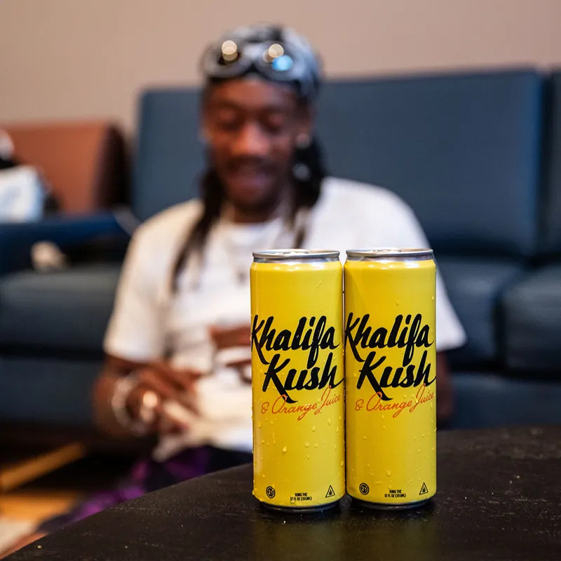 Wiz Khalifa with two cans of Kush and Orange Juice